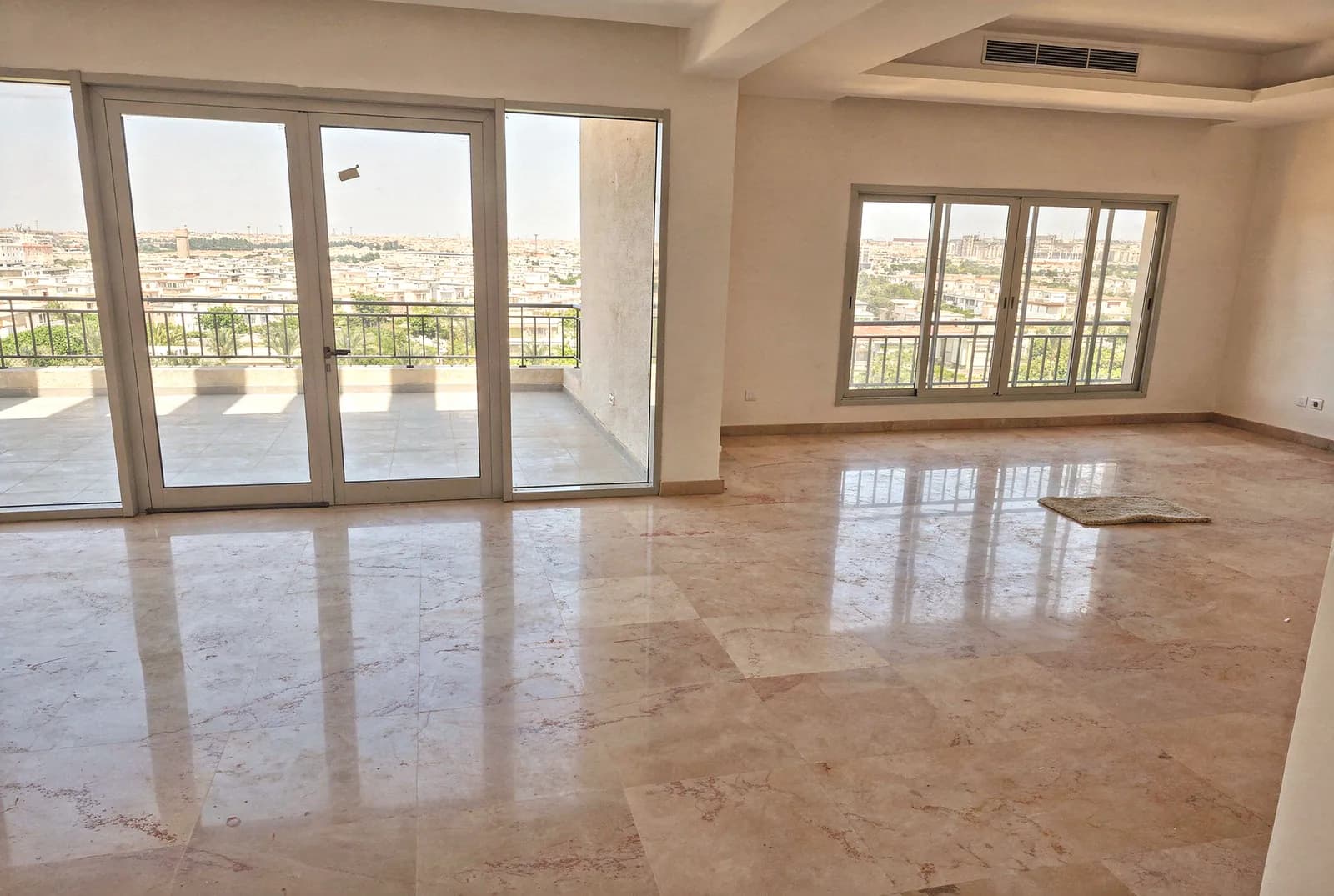 4-bedroom penthouse in Cairo Festival City — reception opening to the terrace