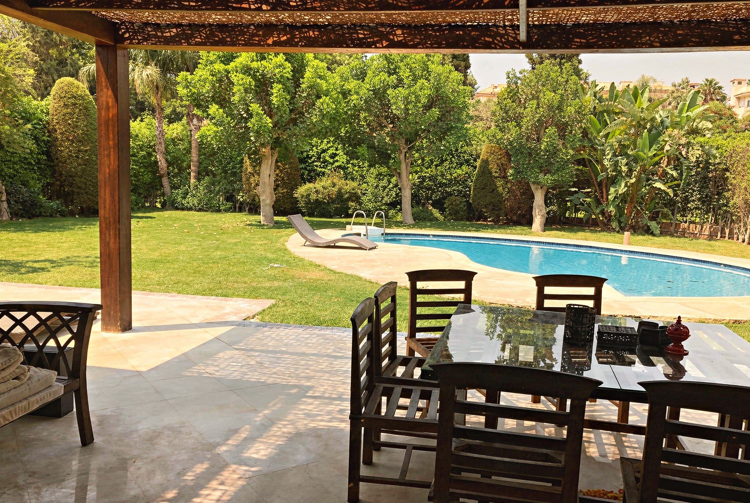 Private pool and landscaped garden with golf course views