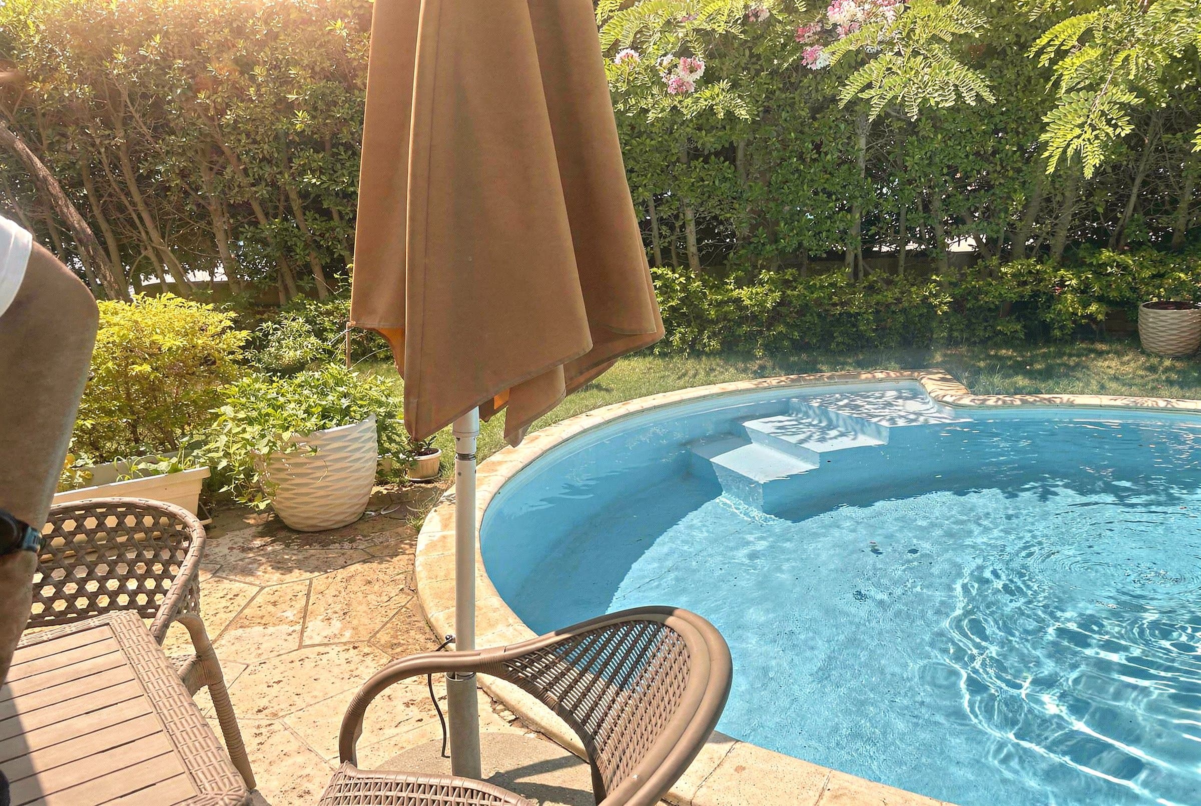 Columned entrance and private pool of a classical villa in Katameya Heights