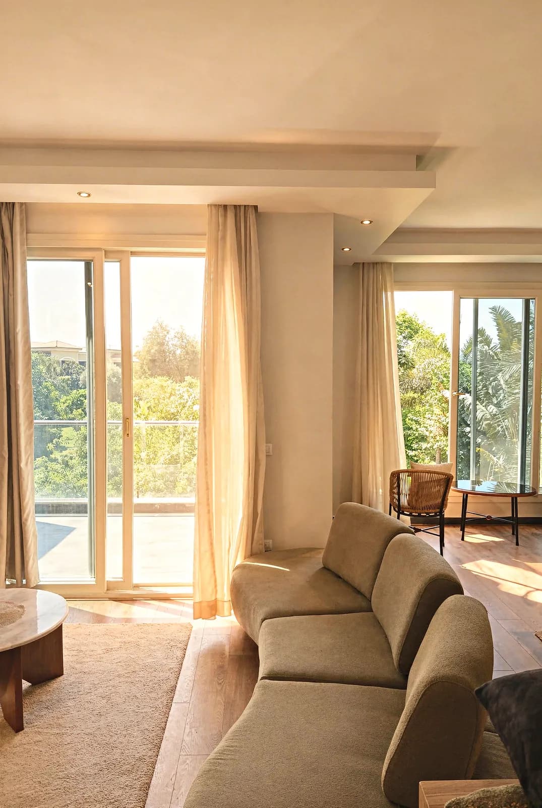 2-bedroom furnished apartment in Lake View Dusit — living area with garden views