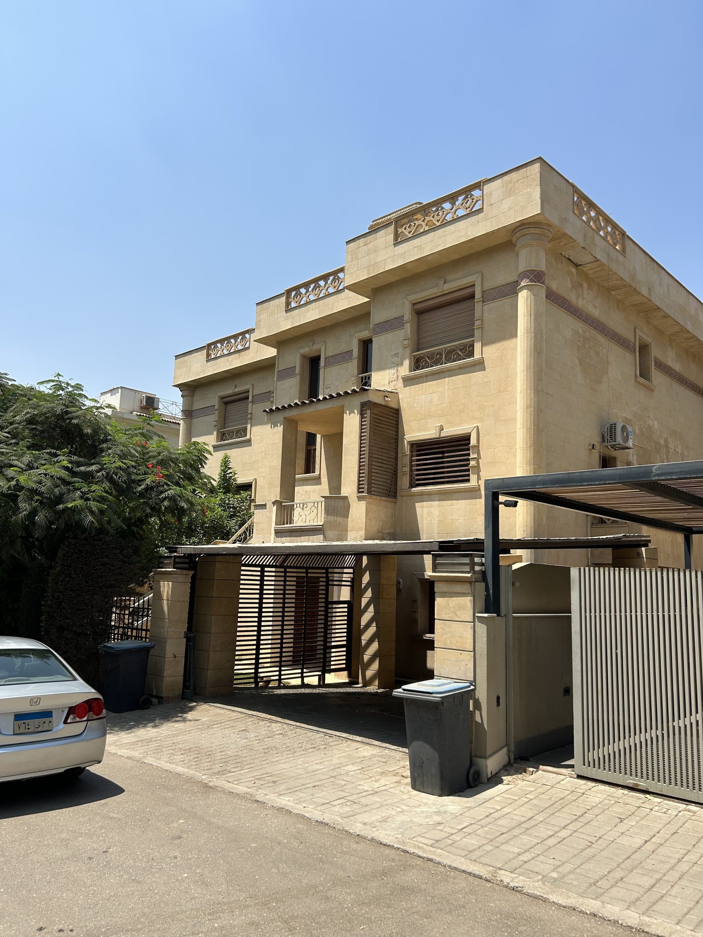 Columned entrance of a classical villa in Katameya Heights