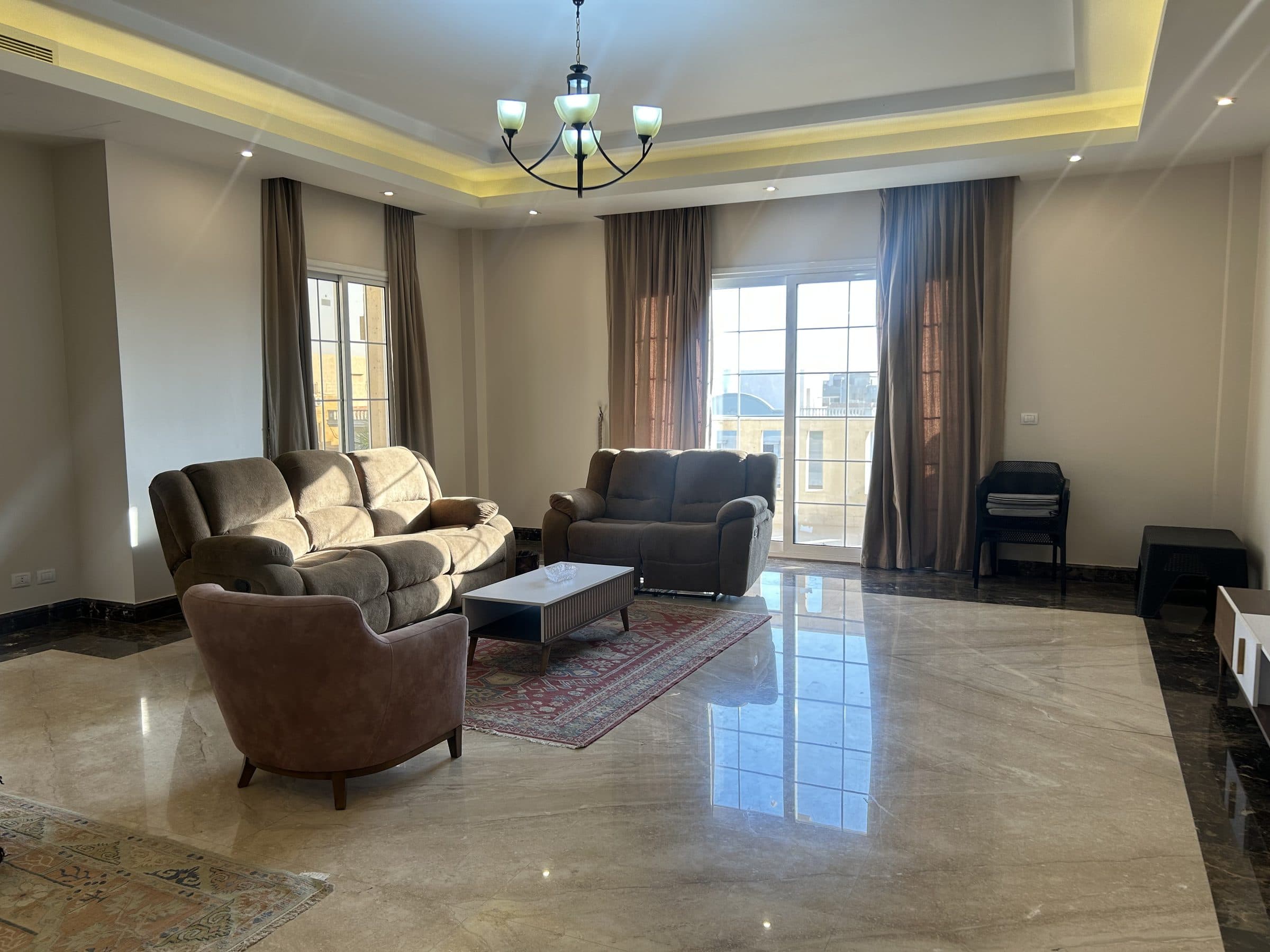 Marble-floored living room with dining table