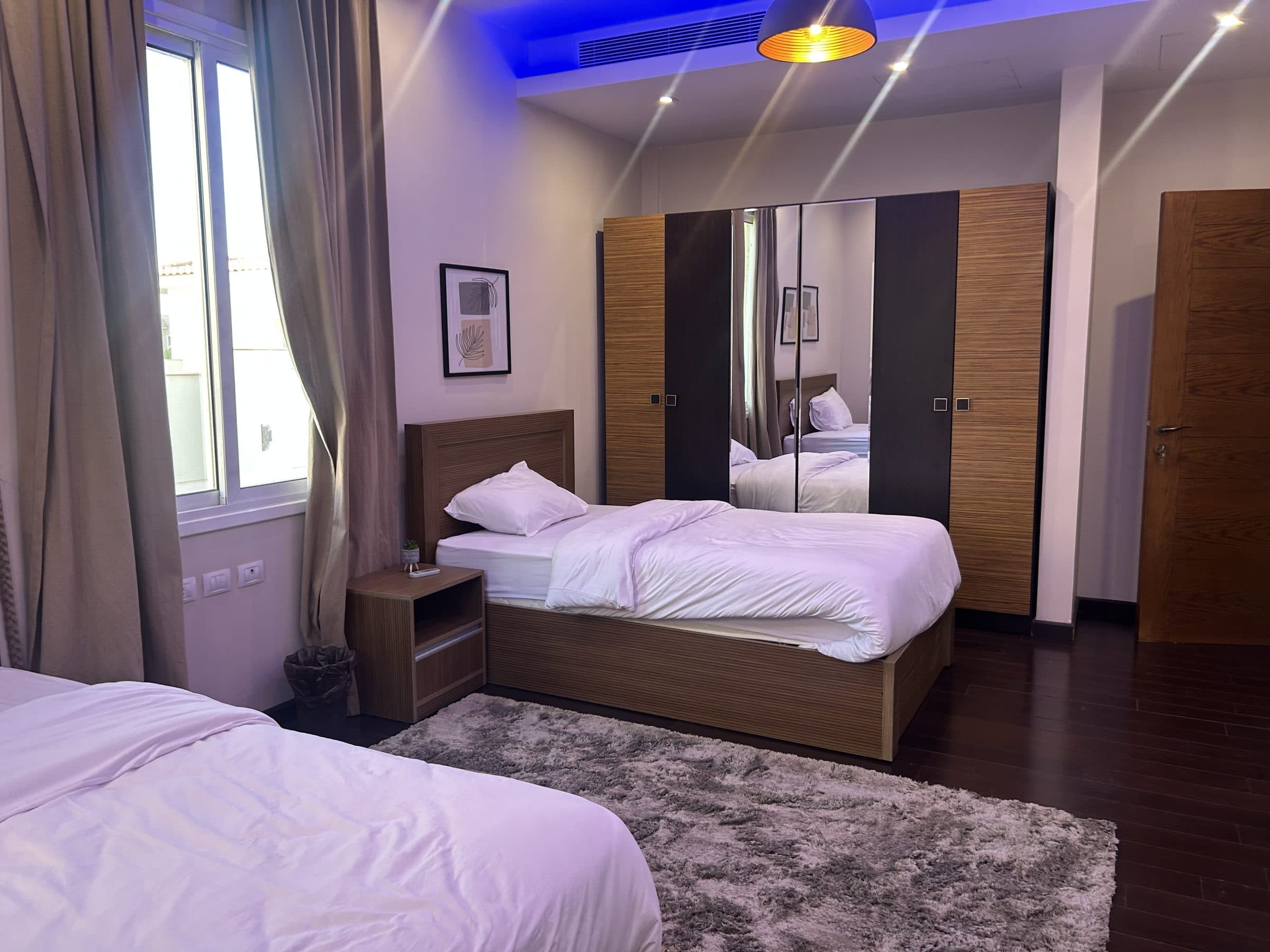 Bedroom with wood furnishings and en-suite dressing area