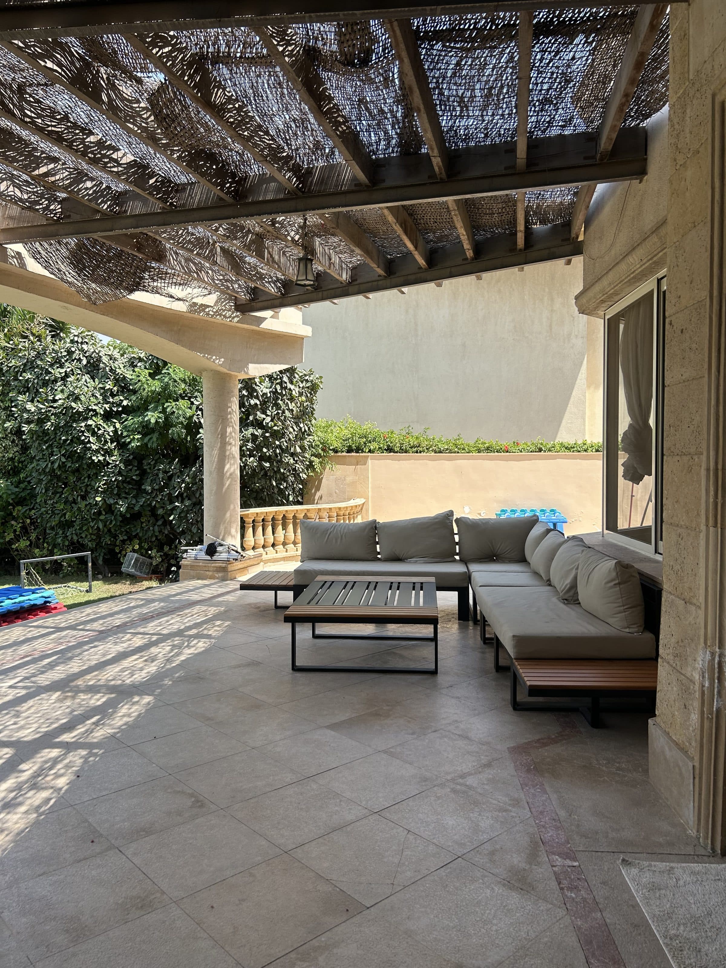 Covered outdoor terrace overlooking the garden